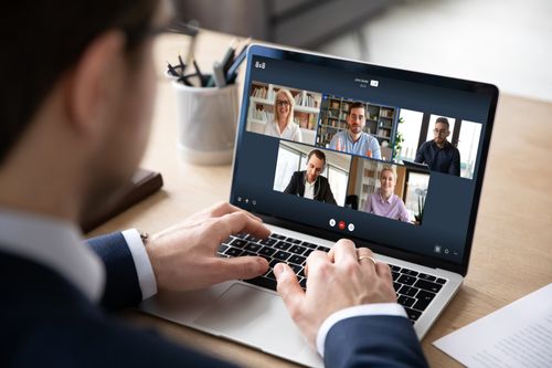 Employee connecting with co-workers and consultants through team chat and video call